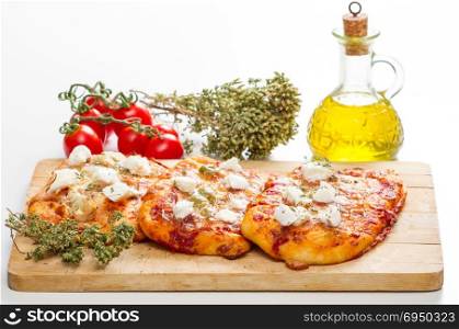 tris of mixed pizza on wood isolated on white with ingredients