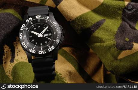 Tritium military watch on camouflage clothing