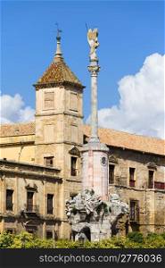 Triumph of Saint Rafael monument and Palacio Episcopal historic facade in Cordoba, Spain, Andalusia region.