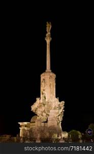 Triumph of Saint Rafael (Spanish:Triunfo de San Rafael) monument at night in the city of Cordoba, Andalusia, Spain.