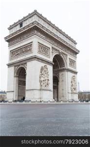 Triumphal arch in a sad and cloudy day, Paris France
