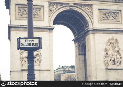 Triumphal arch in a sad and cloudy day, Paris France
