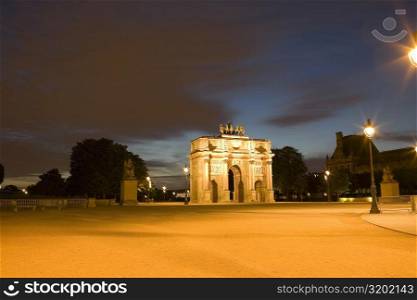 Triumphal arch lit up at night, Jardin De Tuileries, Paris, France
