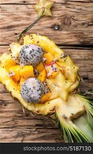 tropic fruits salad in pineapple