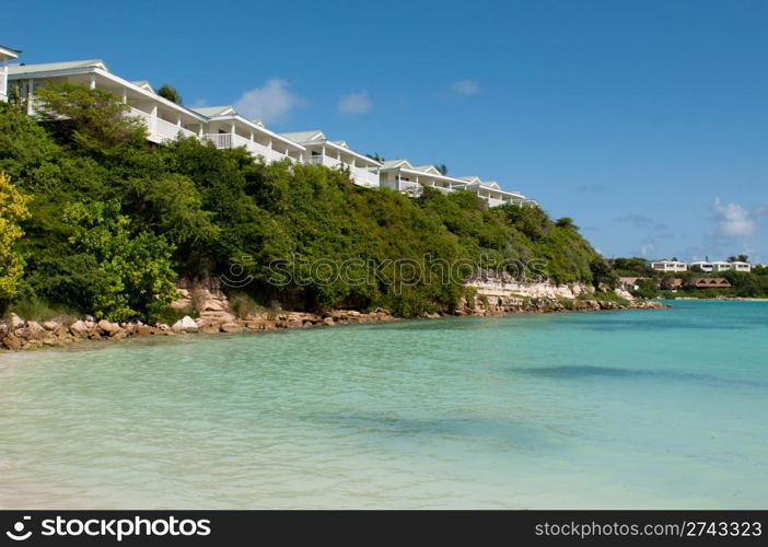 tropical beach and resort villas along the coast in Long Bay, Antigua