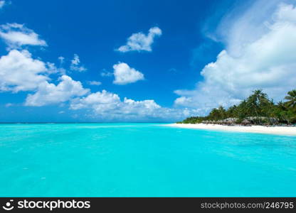 tropical beach in Maldives with blue lagoon