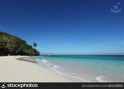 Tropical beach landscape. Beautiful view on tropical beach in Thailand at sunny day