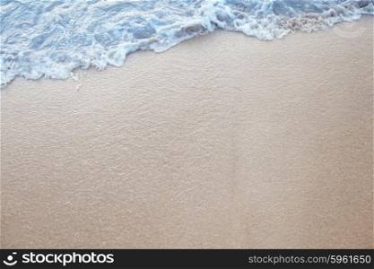 Tropical beach. Natural background with wave coming to sandy beach
