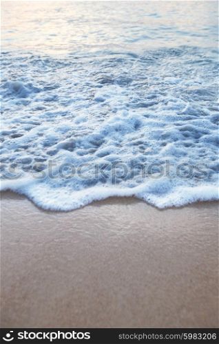Tropical beach. Natural background with wave coming to sandy beach