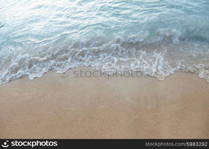 Tropical beach. Natural background with wave coming to sandy beach