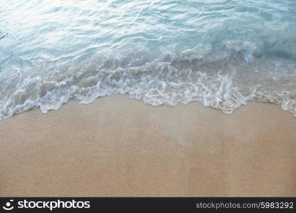 Tropical beach. Natural background with wave coming to sandy beach