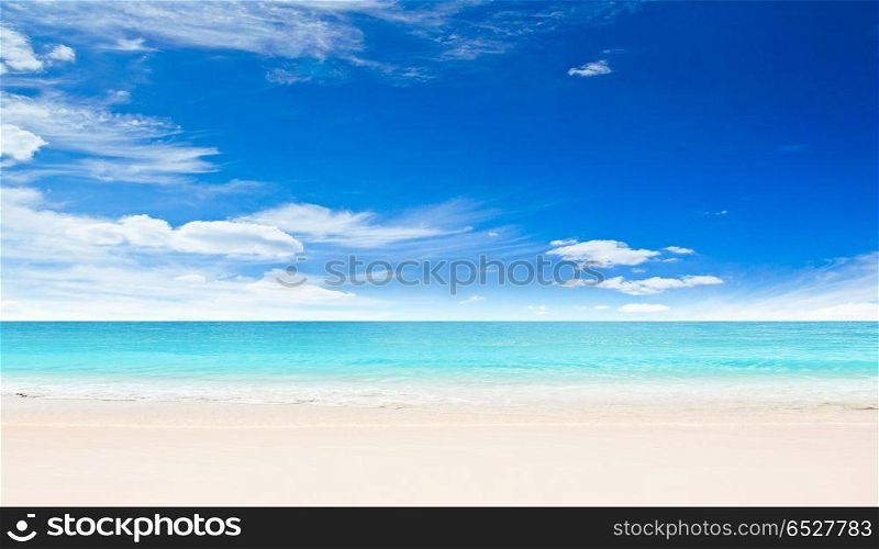 Tropical beach outdoor scene. Tropical beach, sand and sky outdoor scene. Tropical beach outdoor scene