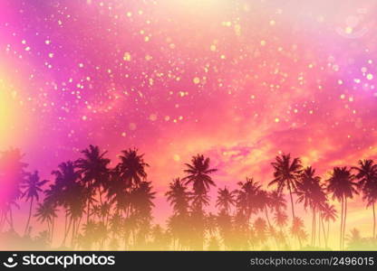 Tropical beach palm trees at sunset silhouettes fairytale party stylized with colofrul light leaks and gold glitter particles