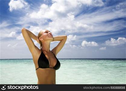 tropical beach: perfect girl meditating on a tropical beach. Copy space