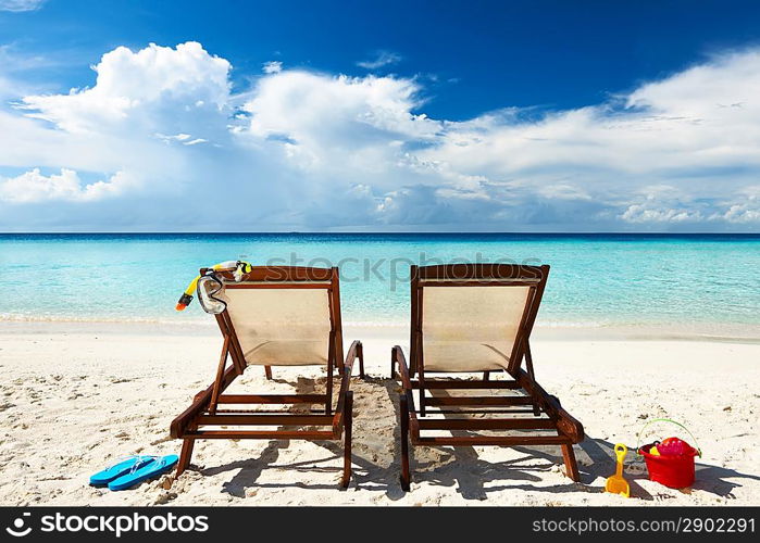 Tropical beach with chaise lounge at Maldives