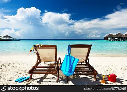 Tropical beach with chaise lounge at Maldives