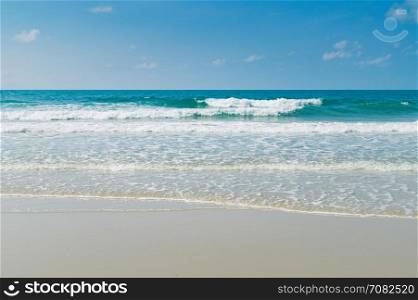 Tropical beach with clear water and blue sky