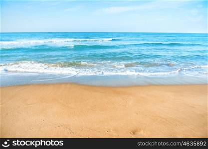 Tropical beach with sand and sea wave at background