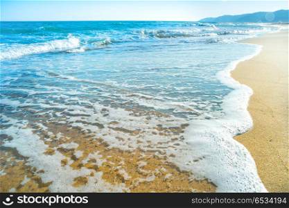 Tropical beach with sand and sea wave at background. Tropical beach with sand and sea