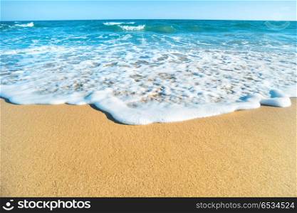Tropical beach with sand and sea wave at background. Tropical beach with sand and sea