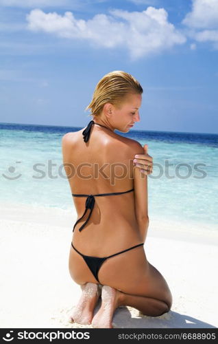 tropical beach: woman relaxing on a tropical beach