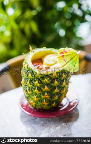 Tropical cocktail in ananas