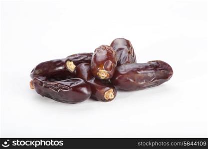 Tropical date fruits isolated over white background