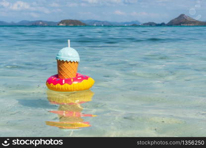 Tropical drinks floating on tropical sea with copy space, Summer vacation and travel concept