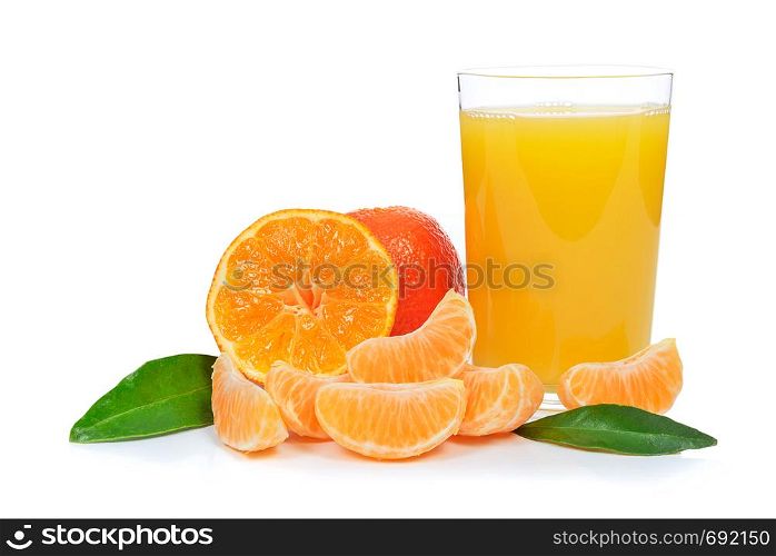 Tropical fruit composition - glass of fresh orange juice and pieces of orange or tangerine isolated on a white background