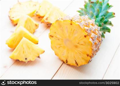 Tropical fruit, Cut and slice pineapples on wooden table
