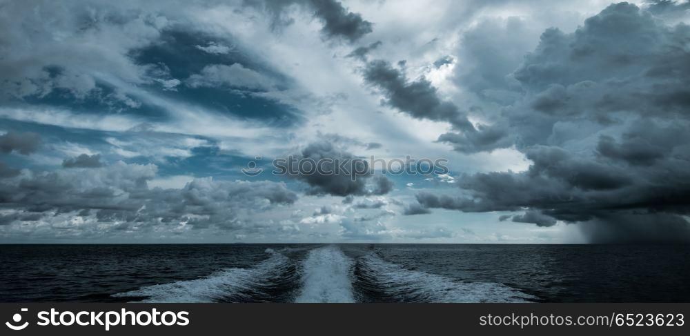 Tropical hurricane from motor boat. Tropical hurricane from motor boat. Water traces and splashes road. Tropical hurricane from motor boat