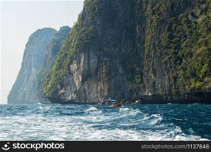 Tropical island view in open sea with touristic boat in Thailand. Tropical island view with touristic boat in Thailand