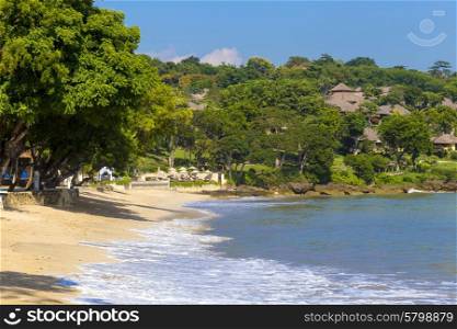 Tropical Jimbaran beach with white sand in Bali, Indonesia