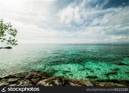 Tropical lagoon island. Tropical lagoon island. Summer caribbean ocean and clouds. Tropical lagoon island