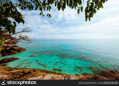 Tropical lagoon island. Tropical lagoon island. Summer caribbean ocean and clouds. Tropical lagoon island