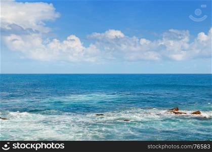 Tropical ocean, high waves and blue sky