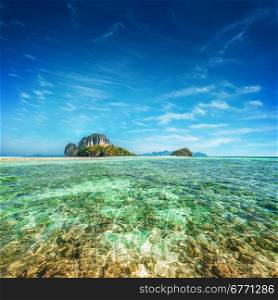 Tropical ocean landscape with Koh Tup island at turquoise water under blue sky.Thailand, Krabi province, Ao Nang