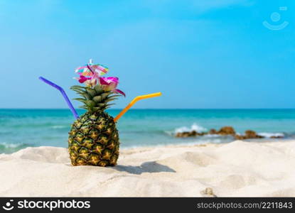 Tropical pineapple cocktail drink at the ocean beach. Tropical pineapple cocktail