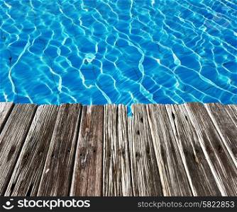 Tropical pool and old wooden pier