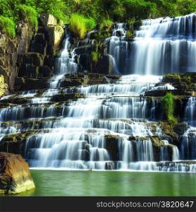 Tropical rainforest landscape with flowing Pongour waterfall. Da Lat, Vietnam