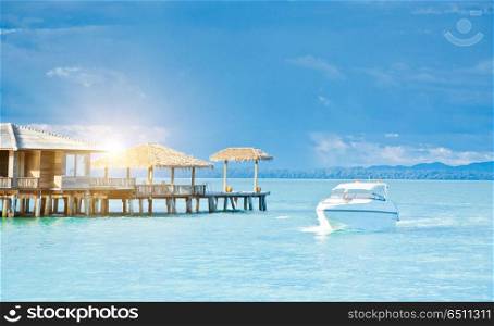 Tropical resort outdoor scene. Tropical resort and yacht in sea outdoor scene. Tropical resort outdoor scene