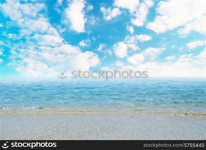 Tropical sand beach with waves and cloudscape.