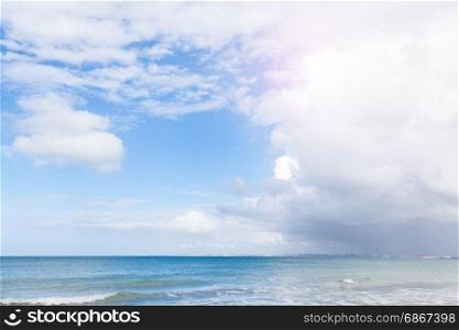 Tropical sand sunny beach and blue cloudy sly