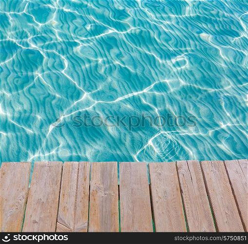 Tropical sea water texture from a wooden pier like paradise summer vacation