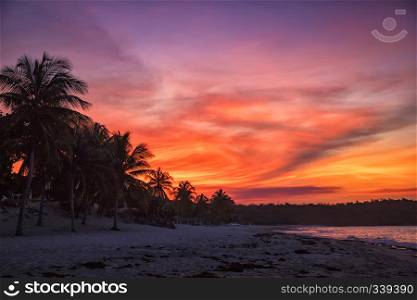Tropical sunset on the beach. Guardalavaca, Cuba