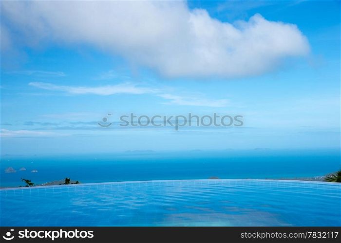 tropical swimming pool with coconut tree