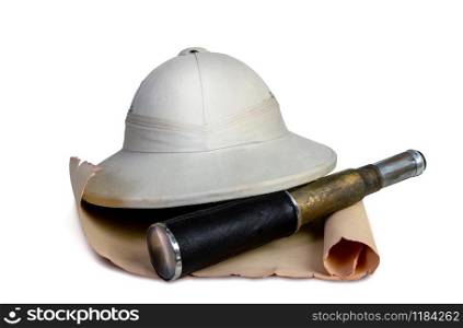 Tropical traveler&rsquo;s cork helmet lying on an old scroll or map next to a spyglass isolated on white background. tropical traveler hat