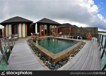 tropical water home villas resort on Maldives island at summer vacation