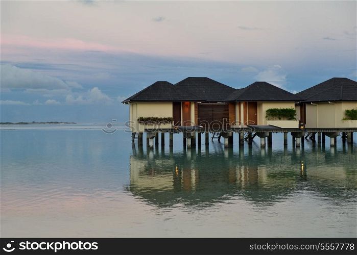 tropical water home villas resort on Maldives island at summer vacation