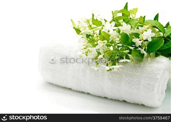 Tropical white and fragrant flower, Wild Water Plum (Wrightia religiosa) with towel on spa theme